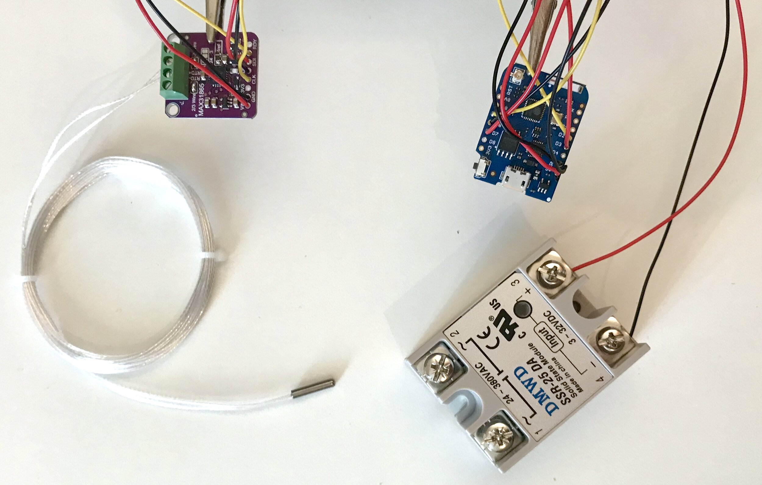 Components of CoffeePID (PT1000 bottom left, MAX31865 top left, WEMOS D1 mini pro top right and the Solid-State-Relay bottom right)